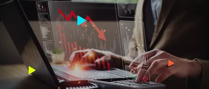 Análise de dados financeiros em laptop com gráficos